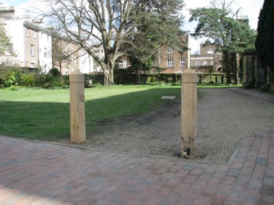 a barrier is needed to prevent car owners using Trinity Garden's lawn for parking