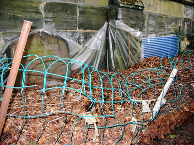 Listed Church Wall, tombstones and the composting problem